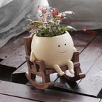 Gyngende blomsterpotte